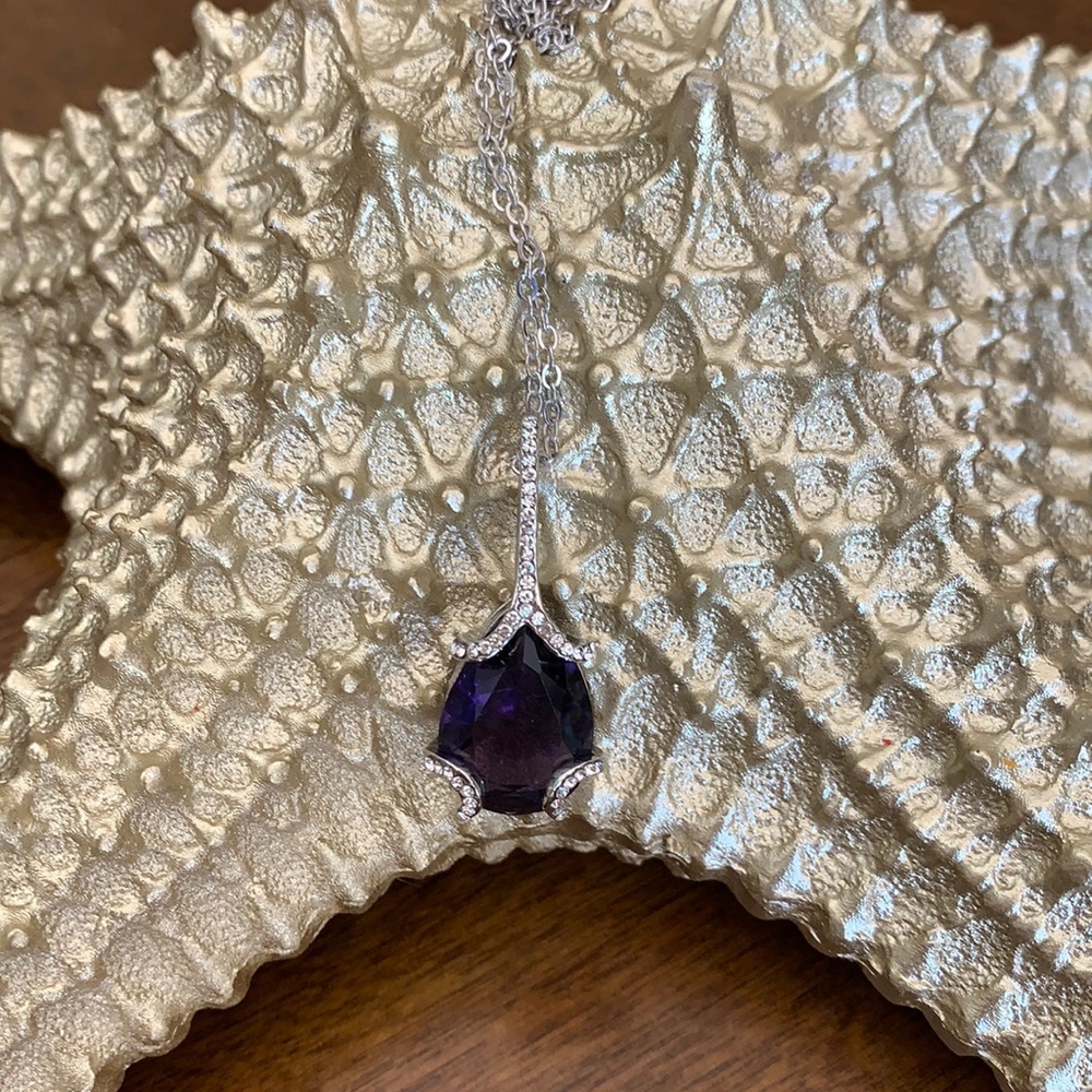 This is a amethyst crystal Necklace goes up to 20 inches NEW no tags